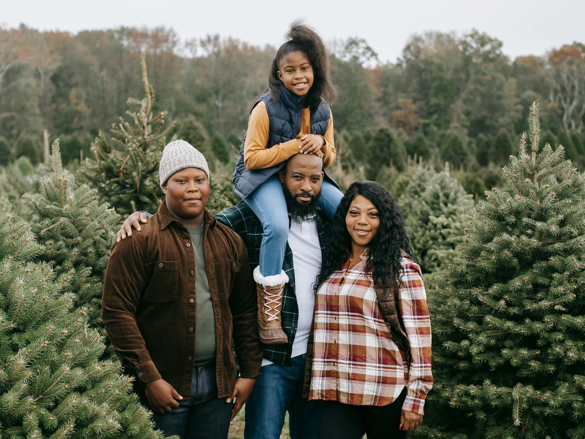 Glass jar of coins beside a growing plant, symbolizing gradual savings growth
