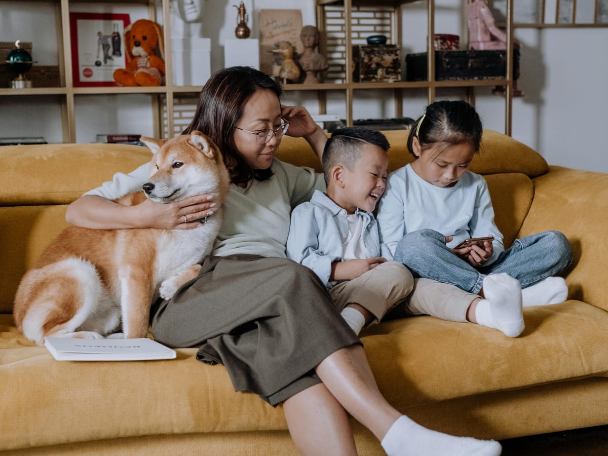 Thoughtful senior reading a policy booklet with a pen in hand, preparing to ask questions